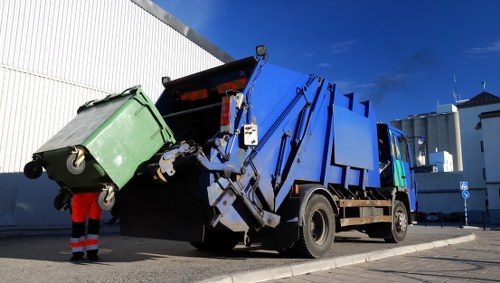 Workers managing construction debris for clearance